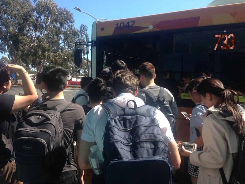 boarding a bus in urban area